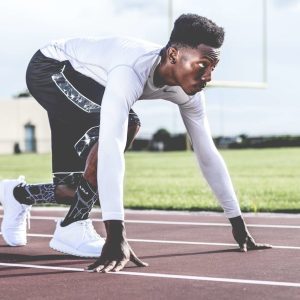 a track athlete getting ready for a sprint