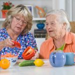 caregiver-and-senior-woman-preparing-meal-copy-1