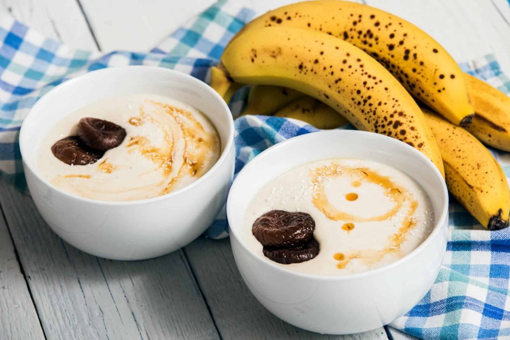 bananas beside bowls of yogurt